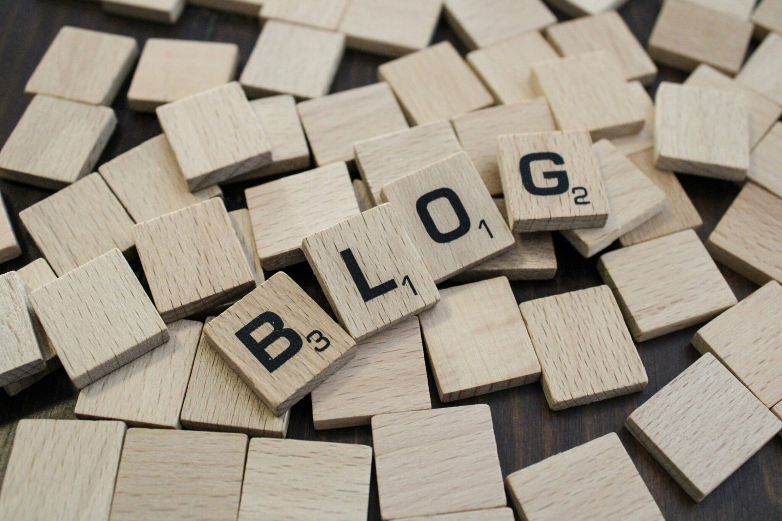 Professional creating digital marketing blog content on a laptop